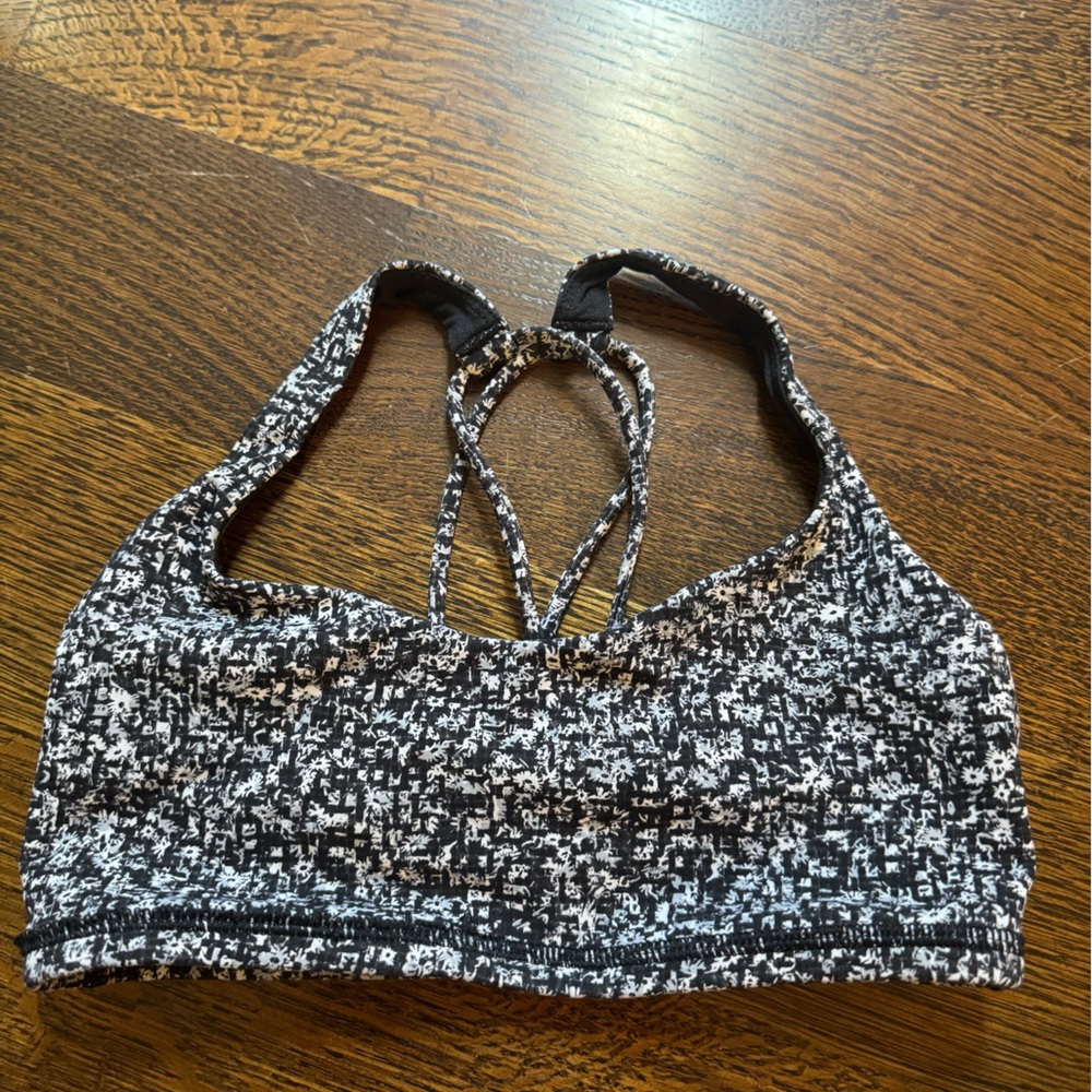 Lululemon sports bra, black flower like pattern, size 2, great condition